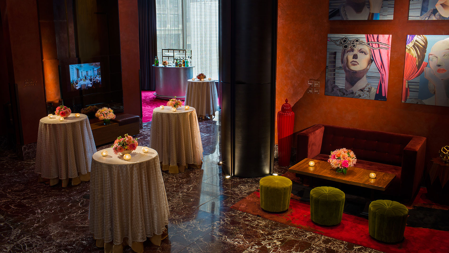 Ventana I foyer area set up for event with circular tables that have floral arrangements and candles