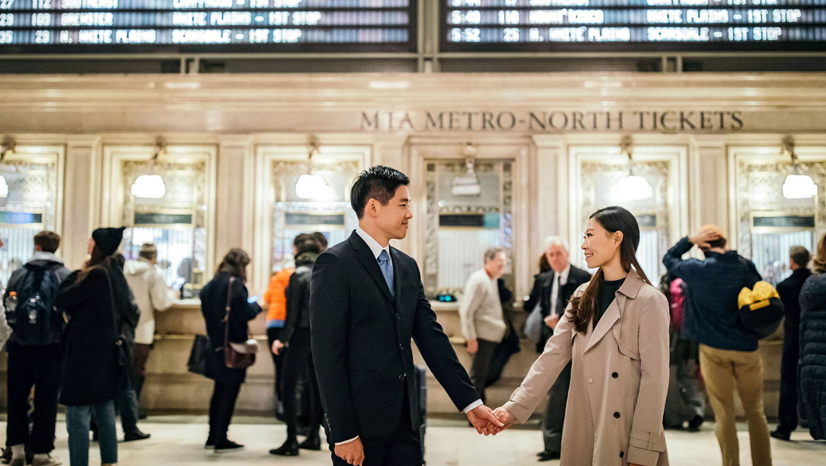 Munji and Eun Joon at Grand Central Station holding hands