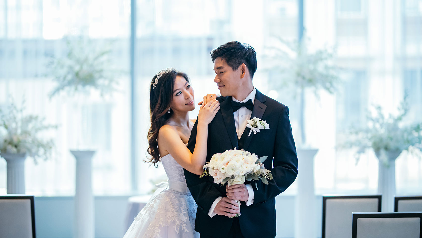 Munji and Eun Joon looking each other longingly as groom holds bouquet of flowers