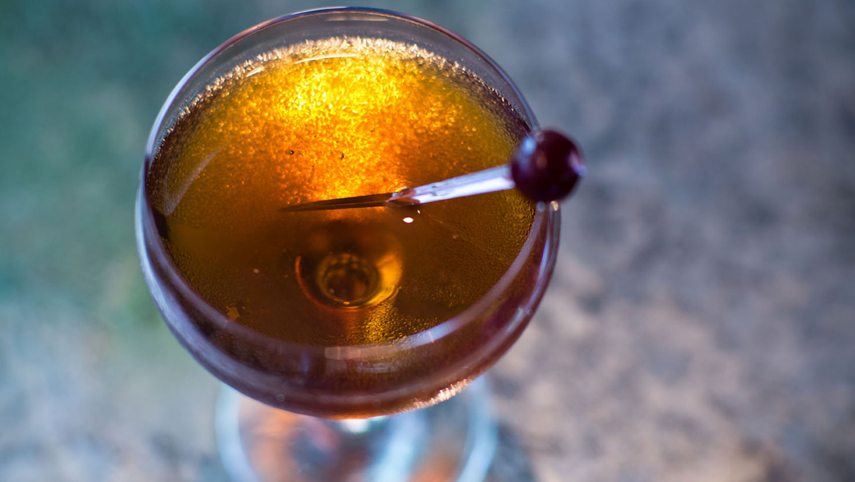 Back Bar cocktail shown from above with stirrer placed in drink