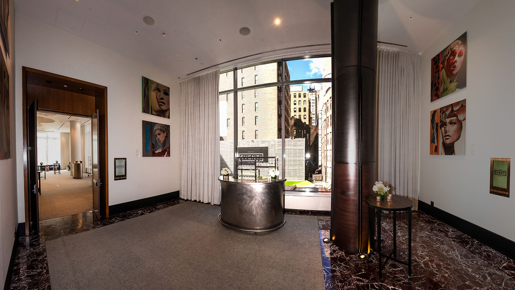 Ventana I event space with seating surrounded by curtains in large ballroom